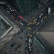 An intersection clustered with cars filled with dead people.